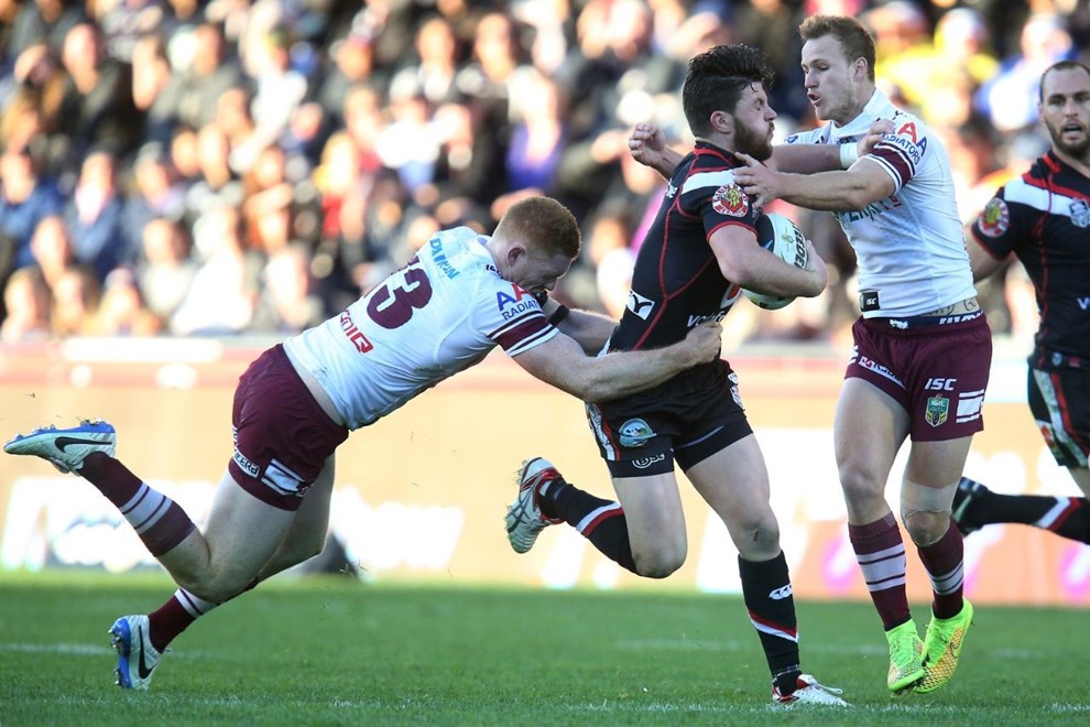 Chad Townsend of the Warriors is tackled by Tom Symonds (L) and Daly Cherry-Evans of the Manly Sea Eagles. New Zealand Warriors v Manly Sea Eagles. NRL rugby league match at Mount Smart Stadium, Auckland, New Zealand. Sunday 27 July 2014. Photo: Jason Oxenham/Photosport.co.nz