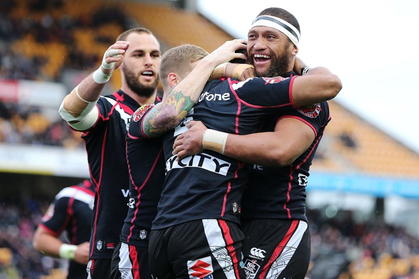 Manu Vatuvei of the Warriors celebrates Dominique Peyroux's try. Round 25 NRL Telstra Premiership game, Vodafone Warriors v Gold Coast Titans, Mt Smart Stadium, Auckland, New Zealand. Sunday 31 August 2014. Photo: www.photosport.co.nz