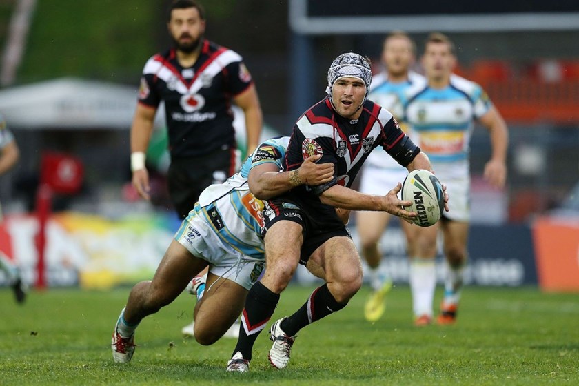 Nathan Friend of the Warriors is tackled by Mark Ioane of the Titans. Round 25 NRL Telstra Premiership game, Vodafone Warriors v Gold Coast Titans, Mt Smart Stadium, Auckland, New Zealand. Sunday 31 August 2014. Photo: www.photosport.co.nz