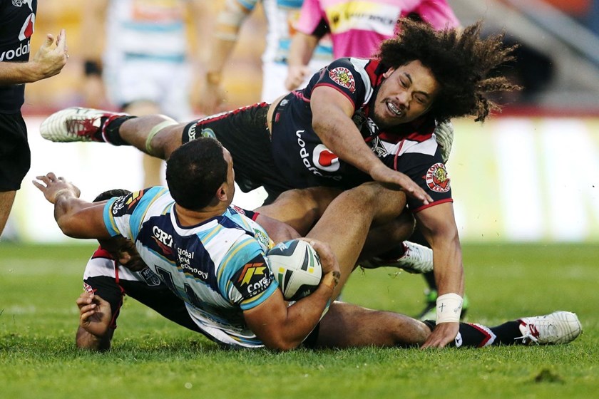 Sione Lousi of the Warriors makes a big hit on Mark Ioane of the Titans. Round 25 NRL Telstra Premiership game, Vodafone Warriors v Gold Coast Titans, Mt Smart Stadium, Auckland, New Zealand. Sunday 31 August 2014. Photo: www.photosport.co.nz