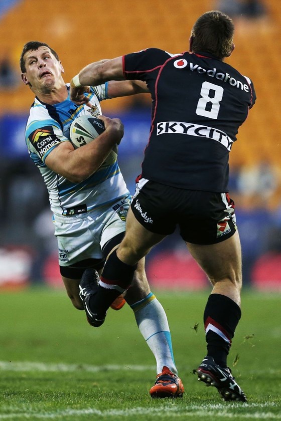 Greg Bird of the Titans clashes with Jacob Lillyman of the Warriors. Round 25 NRL Telstra Premiership game, Vodafone Warriors v Gold Coast Titans, Mt Smart Stadium, Auckland, New Zealand. Sunday 31 August 2014. Photo: www.photosport.co.nz