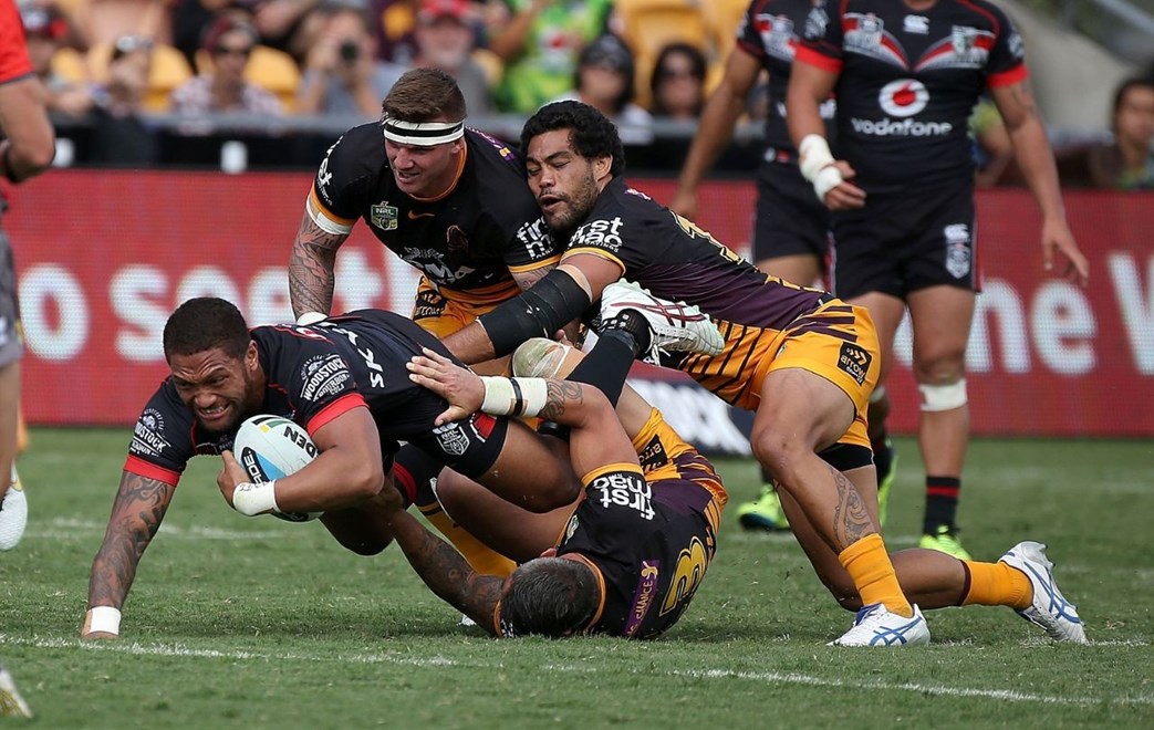 Manu Vatuvei  is brought to ground by multiple Broncos tacklers during the  Warriors vs  Broncos NRL rugby league match played at Mt Smart Stadium in Auckland on 29 March 2015. The match is the 20th anniversary of the Warriors first game which was against the Broncos in 1995. .Photo Copyright; Peter Meecham/ www.photosport.co.nz