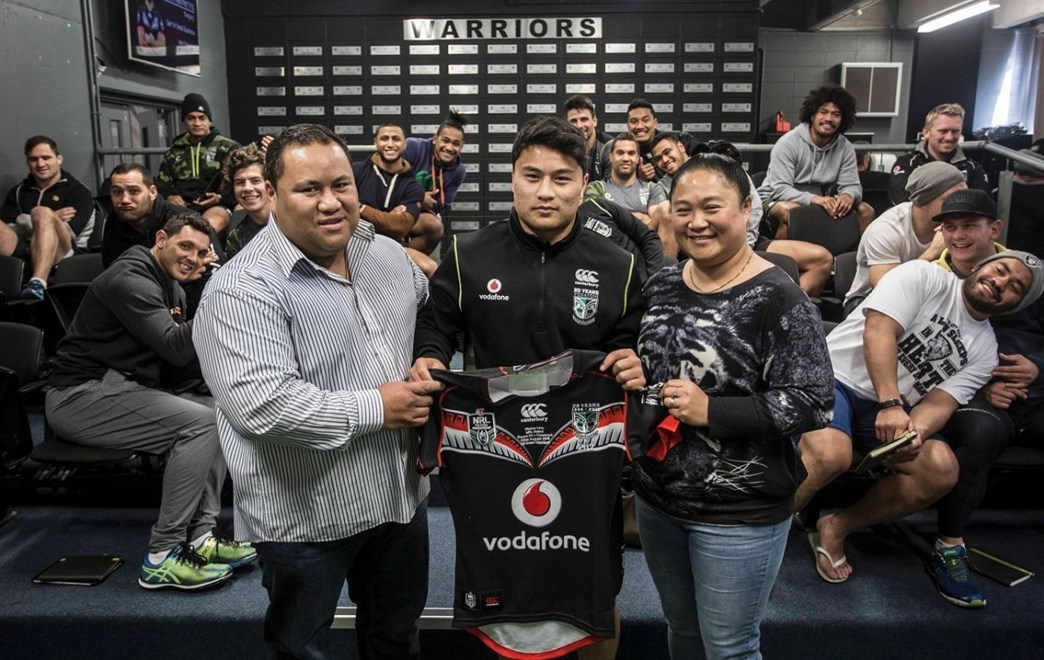 Mason Lino receives his first NRL jersey from his father Jason and mother Marie. Image | Ra Pomare