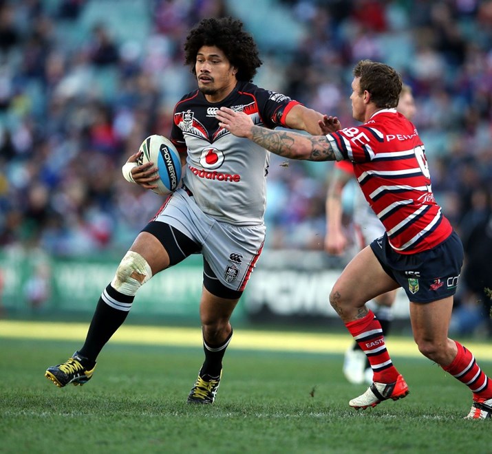 Sione Lousi fends Jake Friend
Roosters v Warriors NRL rugby league match at Allianz Stadium, Sydney Australia. Sunday 19 July 2015. Photo: Paul Seiser/Photosport.co.nz