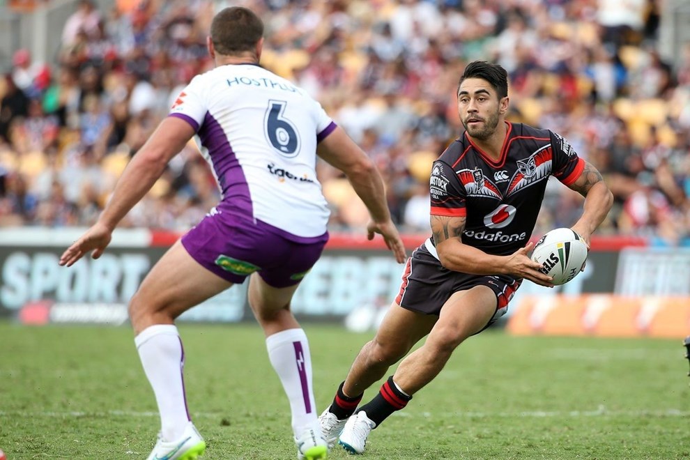 Warrior Shaun Johnson, right, looks to pass in the NRL match between the NZ Warriors and the Storm at Mt Smart Stadium on Sunday, march 20, 2016. Photo: Fiona Goodall/photosport.nz