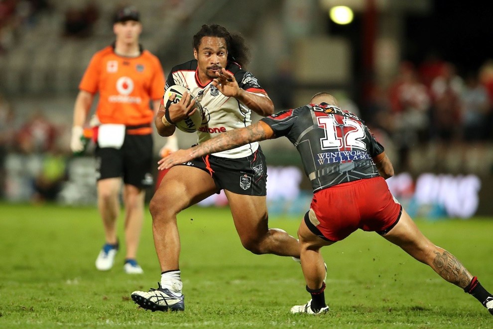 Bunty Afoa on the attack past Joel Thompson
Dragons v Warriors NRL rugby league match at UOW Jubilee Oval